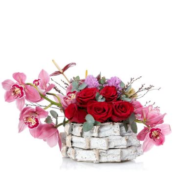 Floral arrangement in basket with cymbidium and hyacinths