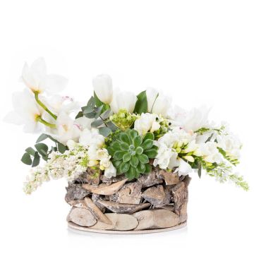 Floral arrangement in basket with ornithogalum and white tulips