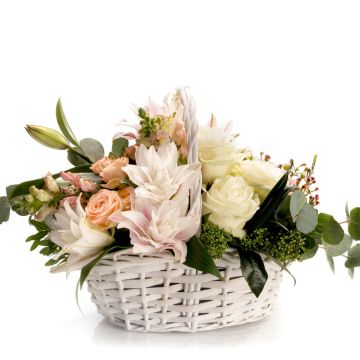 Floral arrangement in basket with mini rose and waxflower