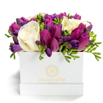 Box of freesias and purple tulips