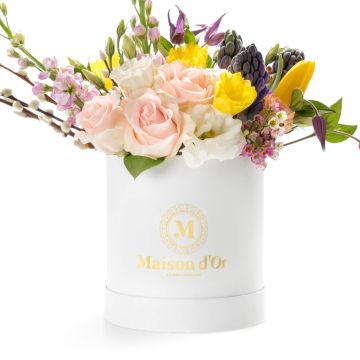 Round white box with tulips and daffodils