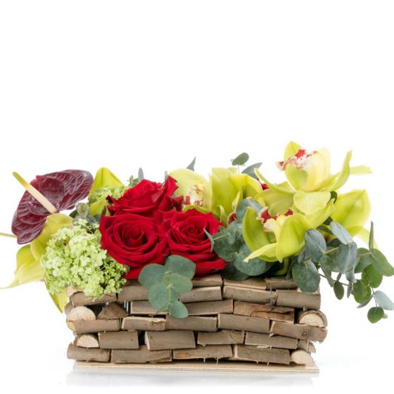 Floral arrangement in basket with hyacinths and orchids