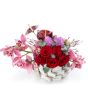 Floral arrangement in basket with cymbidium and hyacinths