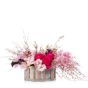 Floral arrangement in basket with cymbidium and genista