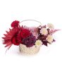 Floral arrangement in the basket with hydrangea and garnet germ
