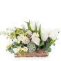 Floral arrangement in basket with lilac and white freesias