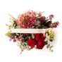 Floral arrangement in basket made of hydrangea and antirrhinum
