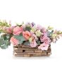 Floral arrangement in basket with antirrhinum and hyacinths