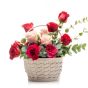 Floral arrangement in basket of pink roses, cyclamen, tomatoes