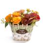 Floral arrangement in basket from roses, anthurium