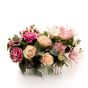 Floral arrangement in basket with pink roses and hypericum