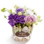 Floral arrangement in basket from rose, chrysanthemum, alchemilla